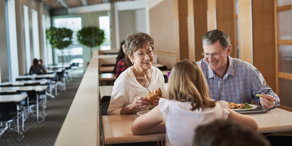 A family enjoying a meal at the Cafeteria. 